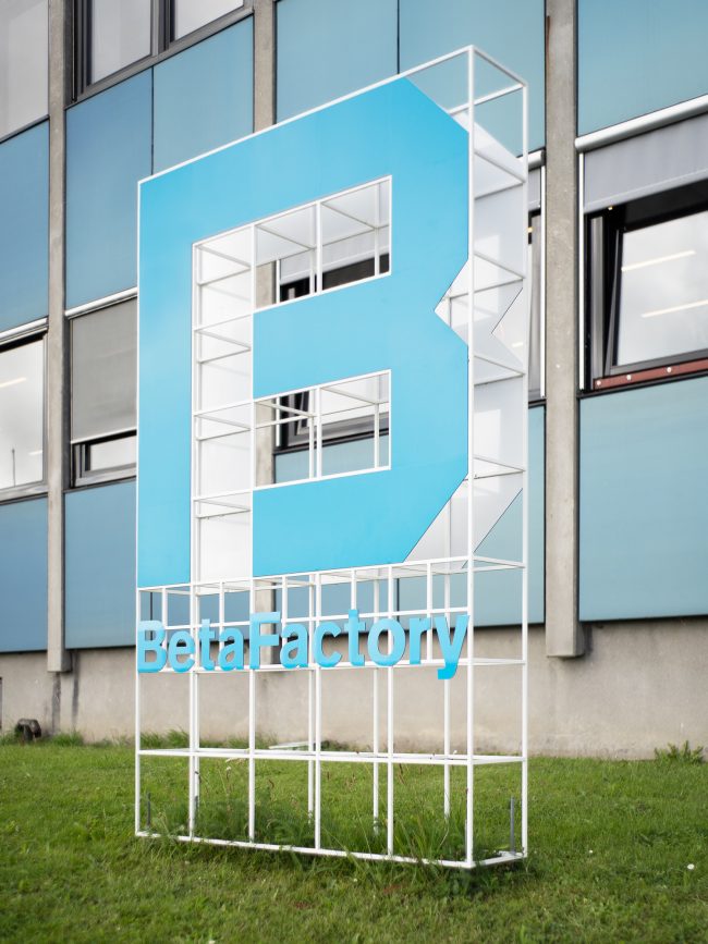 BetaFactory sign in front of building.