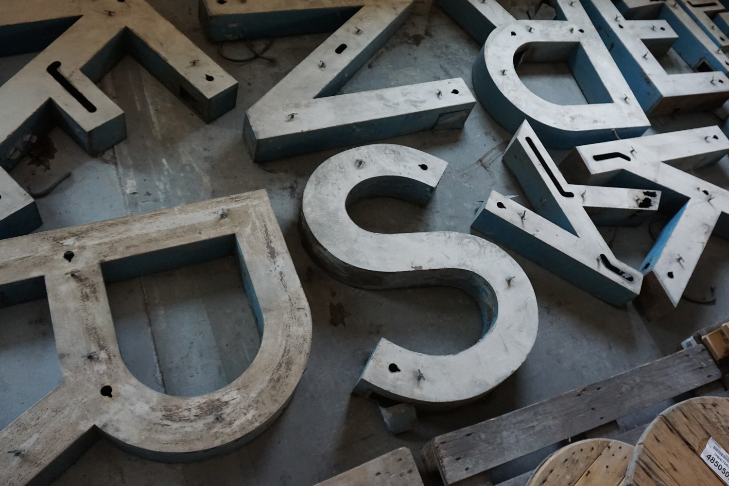Rusty sign letters from historic roof sign.