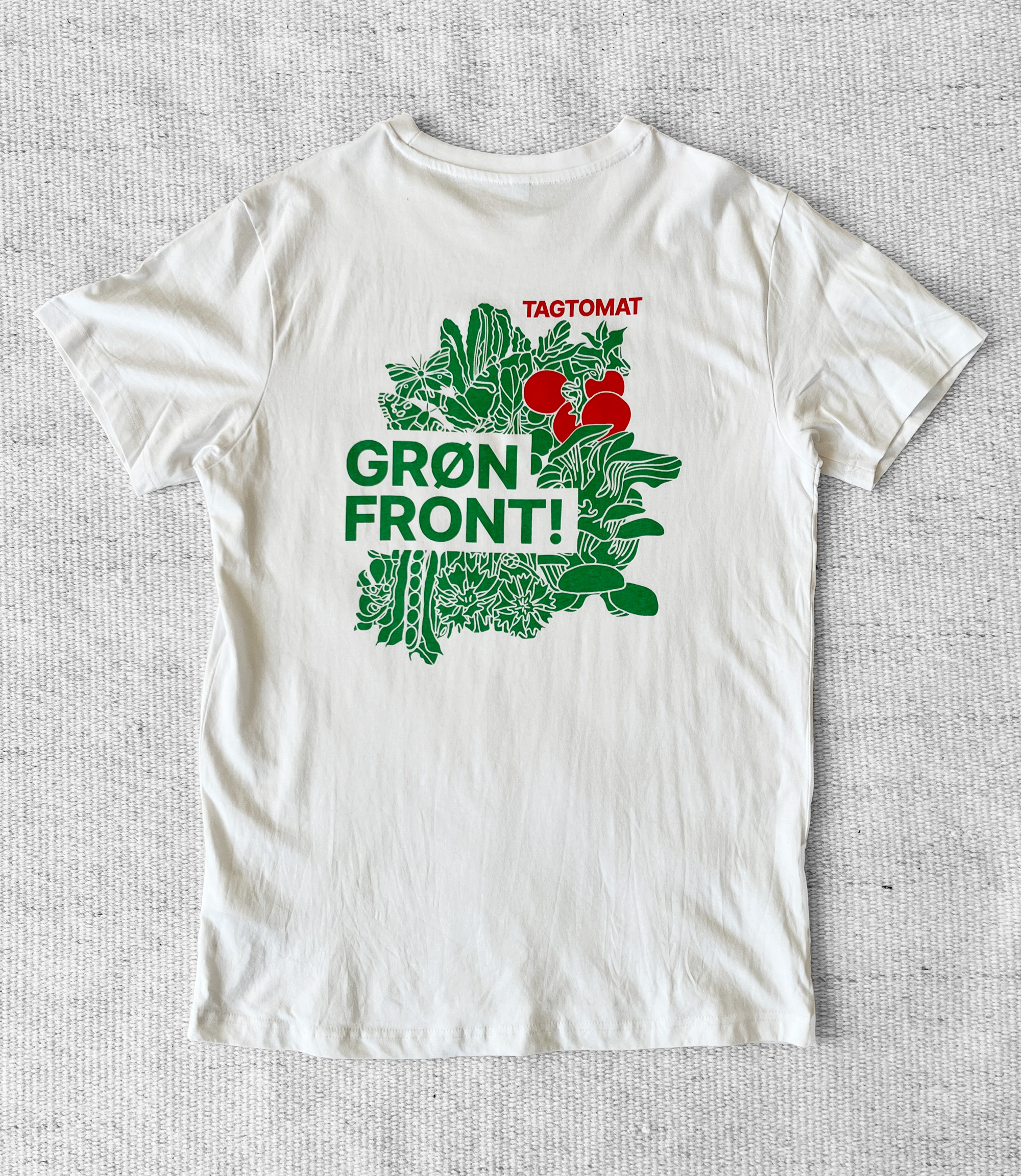 White TAGTOMAT t-shirt with plant illustrations and slogan.